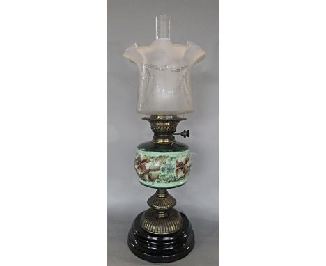 A Duplex oil lamp with brass stand, a floral font and a flared shade, 57 cm tall 