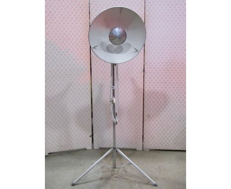 A retro floorstanding tripod lamp with tubular chromium stem and dished aluminium shade 