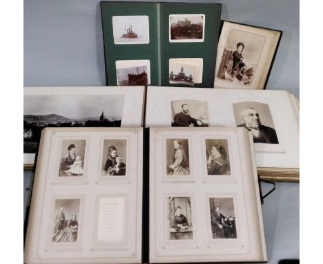Two late 19th/early 20th century family portrait albums both with metal clasps, together with two smaller portrait albums (4)
