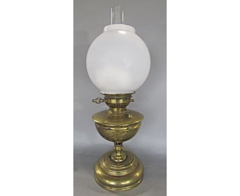 An Invicta oil lamp, brass stand and opaque spherical shade, 54 cm high 