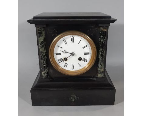 A Victorian black slate and polished marble mantel clock with enamelled dial and eight striking movement with pendulum and ke