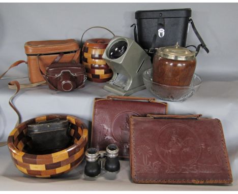 A miscellaneous collection of items, salad bowl, biscuit barrel, cameras, binoculars, leather manuscript folder, etc 