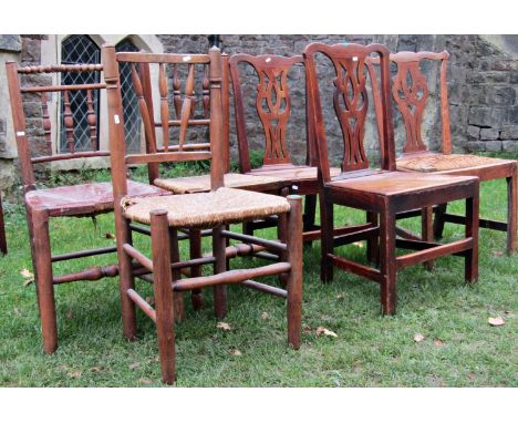 A pair of Georgian country made Chippendale style dining chairs with pierced vase shaped splats, solid seats and square cut s
