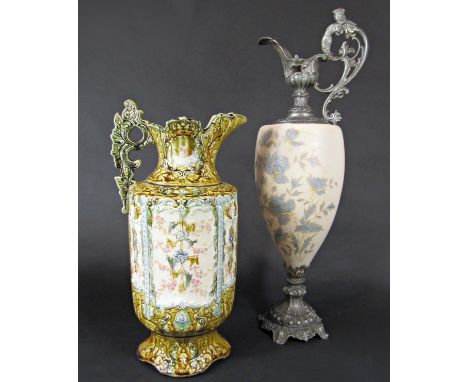 A large glass ewer with metal mounts and a majolica type pitcher 