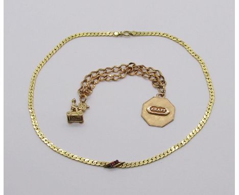Unusual yellow metal curb link bracelet hung with a 'Kraft' medallion and cameraman charm, the medallion stamped '1/10 10k', 