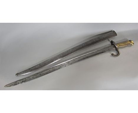 A 19th century French bayonet, 70 cm long with its original iron scabbard 