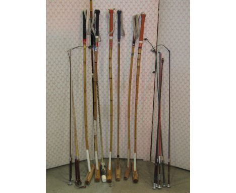 A collection of polo mallets with bamboo shafts and printed stamps to heads, J C Giannastascio J M Argentina, together with f