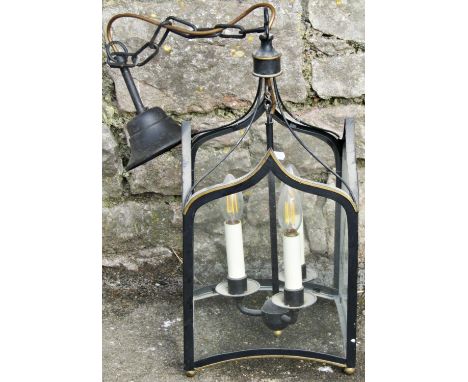A contemporary Regency gothic style hall lantern of square form with glazed arched panels, enclosing a simple stem with three