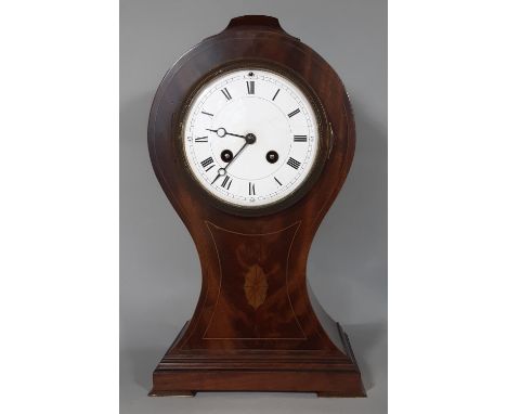 An inlaid Edwardian mahogany mantel clock in a balloon shaped case with convex enamelled dial and eight day striking French m