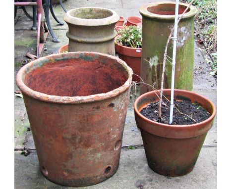 A weathered terracotta planter of circular tapered form 50 cm in diameter x 45 cm high (AF), together with two reclaimed terr