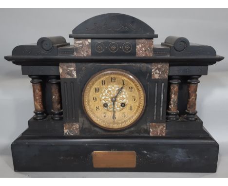 A mid-Victorian period black slate and polished marble mantel clock of architectural form, with eight day striking movement, 