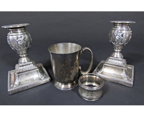 A pair of silver candlesticks with embossed classical scenes, London 1895, by Richard Hodd &amp; Son, 11.5 cm high, together 