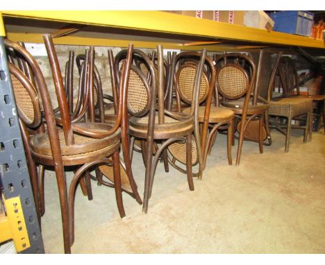15 bentwood cafe chairs with circular cane panelled seats and backs together with two wicker dining chairs, an elm and beech 