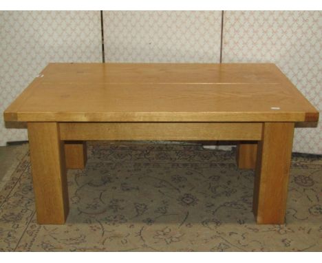 Good quality contemporary light oak low occasional table, the rectangular two plank top with cleated ends raised on square cu