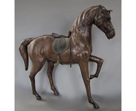 A leather model of a prancing horse, 49 cm x 50 cm approximately 