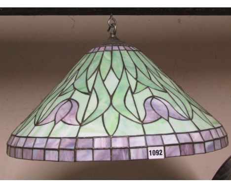 A Tiffany style coloured leaded light domed ceiling light/shade with foliate detail in purple and green shades, 52 cm diamete