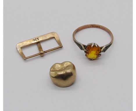 A gold tooth together with a 9ct watch buckle and a 9ct silver set citrine ring, 6.3g total gross (3) 