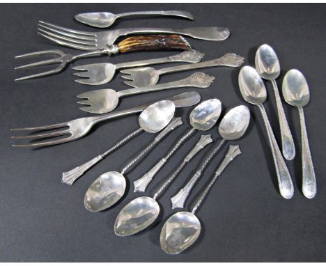 Silver cutlery comprising three dessert forks, ten assorted teaspoons, two further forks and an antler handled silver plate f