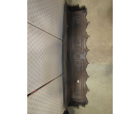 A stained oak hall wall shelf, with moulded outline enclosing two rectangular panels with carved shell and foliate detail, ov