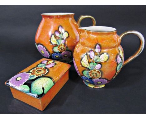A collection of Carltonware art deco lustre wares in the Hollyhock pattern on an orange ground comprising a jug of globular f