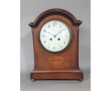 An inlaid Edwardian mahogany mantel clock with string inlay and other detail, with enamelled convex dial and eight day striki