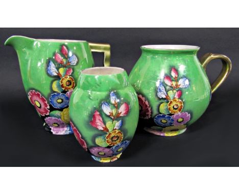 A collection of Carltonware art deco lustre wares in the Hollyhocks pattern, all with green ground and comprising a jug 20cm 