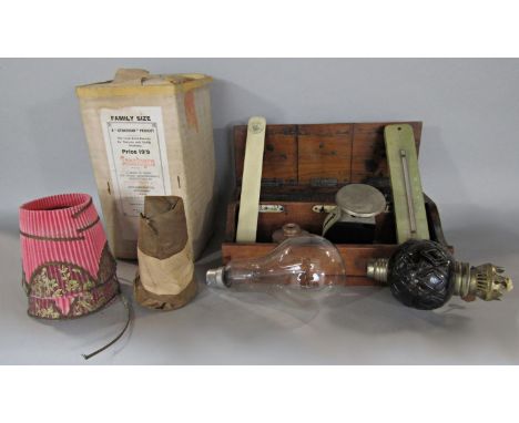 A Victorian mahogany desk top pen rack along with assorted items thermometer, letter opener, crochet bulbs, a light bulb, let