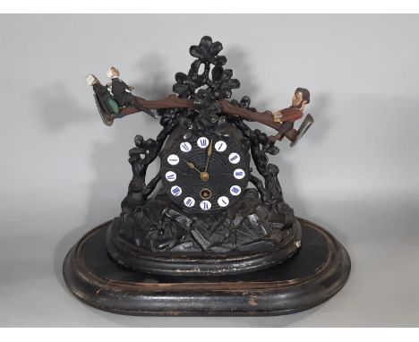 An American mantel clock in carved spelter, the clock face simulating a timber log, with applied Roman numerals in enamel, su
