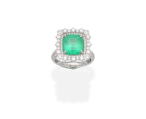 KAT FLORENCE: EMERALD AND DIAMOND RINGThe step-cut emerald within a surround of brilliant-cut diamonds, between shoulders set