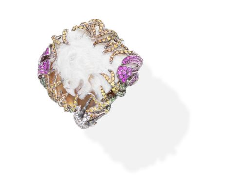 WENDY YUE: CAMEO AND GEM-SET DRESS RING, 2012The shell cameo of a lion's head set within tendrils and leaves with an antelope