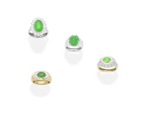 FOUR JADE AND DIAMOND RINGSThree set with jade cabochons and brilliant-cut diamonds, one set with a carved jade frog, between