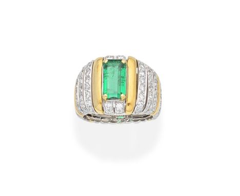 EMERALD AND DIAMOND DRESS RINGOf reeded, bicoloured design, set with a rectangular step-cut emerald and brilliant-cut diamond