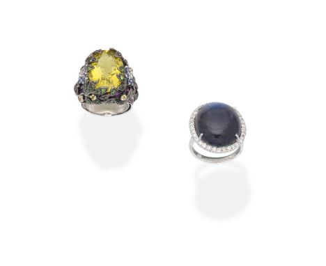 TWO GEM-SET AND DIAMOND DRESS RINGS1st: Set with an oval-cut treated quartz within a foliate mount set with brilliant-cut dia