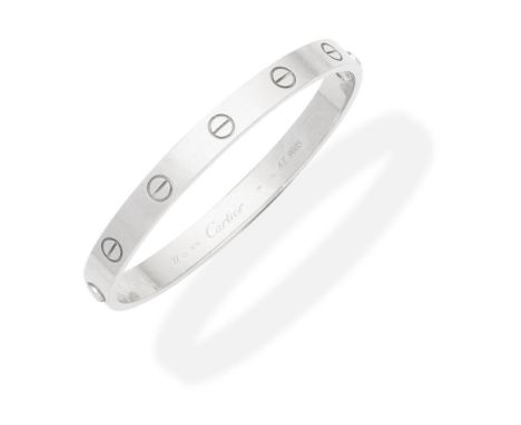 CARTIER: 'LOVE' BANGLEThe 18 carat white gold bangle with screwhead motifs, signed Cartier, numbered, Swiss assay mark, Europ