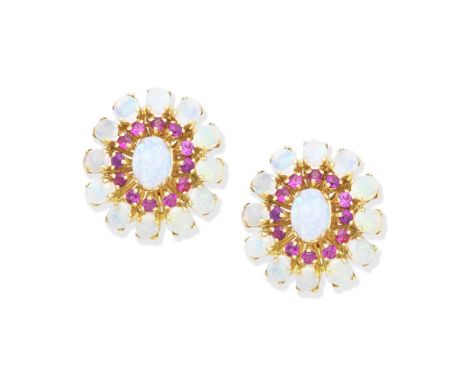 OPAL AND RUBY EARCLIPSEach set with radiating oval opal cabochons and circular-cut ruby accents, length 2.5cmFor further info