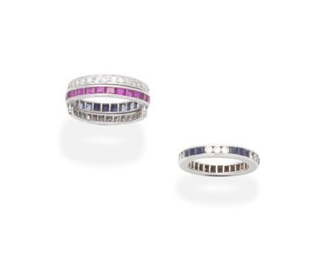 TWO GEM-SET RINGS1st: Set with rectangular step-cut rubies to one side, and similarly cut sapphires to the other, with hinged