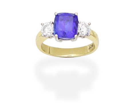 TANZANITE AND DIAMOND THREE STONE RINGThe cushion-shaped tanzanite between two brilliant-cut diamonds, ring size approx. PFoo