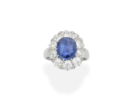 SAPPHIRE AND DIAMOND CLUSTER RINGThe cushion-shaped sapphire within a cushion-shaped diamond surround, diamonds approx. 2.30c