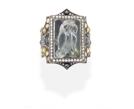 SEVAN BIÇAKÇI: DIAMOND AND COLOURED DIAMOND INTAGLIO RING, 2011The rock crystal reverse carved to depict an owl, within a mou