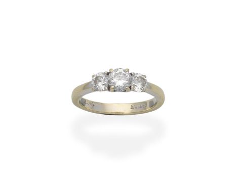 BROWNS: DIAMOND THREE-STONE RINGThe central brilliant-cut diamond weighing 0.51 carat, set between two similarly cut diamonds