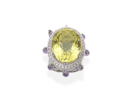 YELLOW BERYL, AMETHYST AND DIAMOND DRESS RINGThe oval-cut yellow beryl within a brilliant-cut diamond surround, the border ac