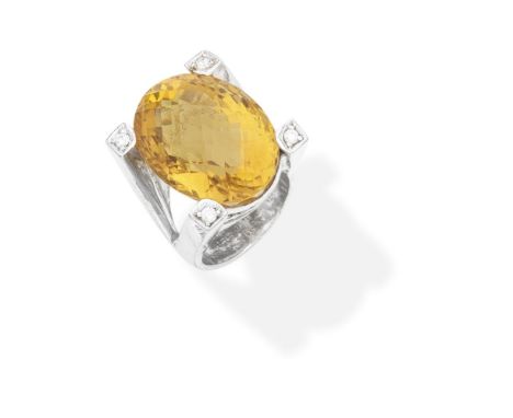CITRINE AND DIAMOND RINGThe oval-cut citrine set with brilliant-cut diamonds to each claw, ring size approx. PFor further inf