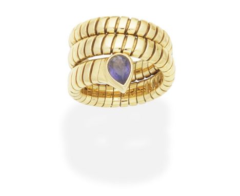 BULGARI: IOLITE- SET 'TUBOGAS' RINGThe coiled spring hoop, terminating in a pear-shaped iolite, signed Bulgari, ring size ver