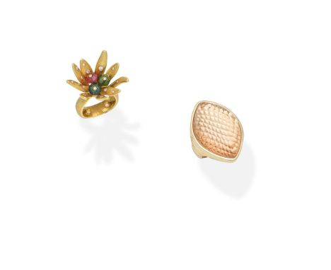 TWO GEM-SET DRESS RINGS1st: Set with a marquise-shaped rock crystal cabochon, on a faceted rose coloured ground, 2nd: Of abst