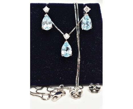 A WHITE METAL NECKLACE AND EARRING SET, a pear cut blue topaz, set with a single circular cut cubic zirconia, prong set in wh