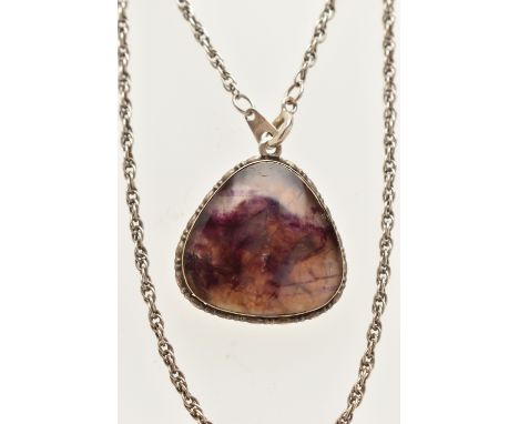A BLUE JOHN PENDANT WITH CHAIN, the pendant set with a triangular shape blue john cabochon, within a grooved border, suspende