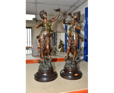 AFTER L &amp; F MOREAU: A PAIR OF BRONZED SPELTER FIGURES, depicting art nouveau style female figures, supported on socle bas