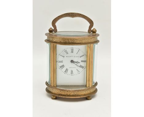 A FRENCH 'ELLIOTT &amp; SON, LONDON' CARRIAGE CLOCK, of an oval form, white Roman numeral dial, five glass viewing panels, ke