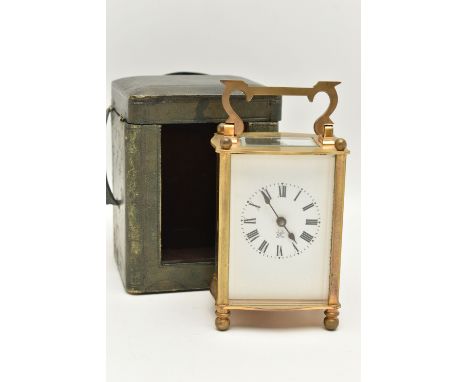 A CASED CARRIAGE CLOCK, brass clock with white Roman numeral dial, key wound, signed to the movement 'Made in France', togeth