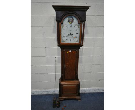 A GEORGIAN OAK EIGHT DAY LONGCASE CLOCK, Corinthian style pillar supports flanking an arched glass door, that's enclosing a 1